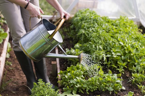 Operative using garden tools with protective gear